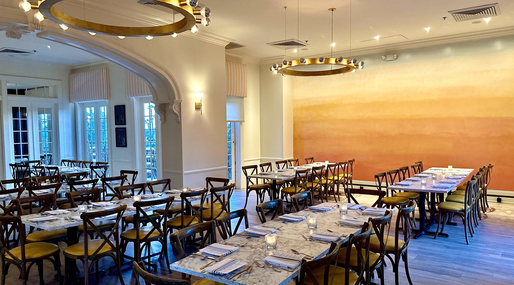 Long tables and seating area in event room
