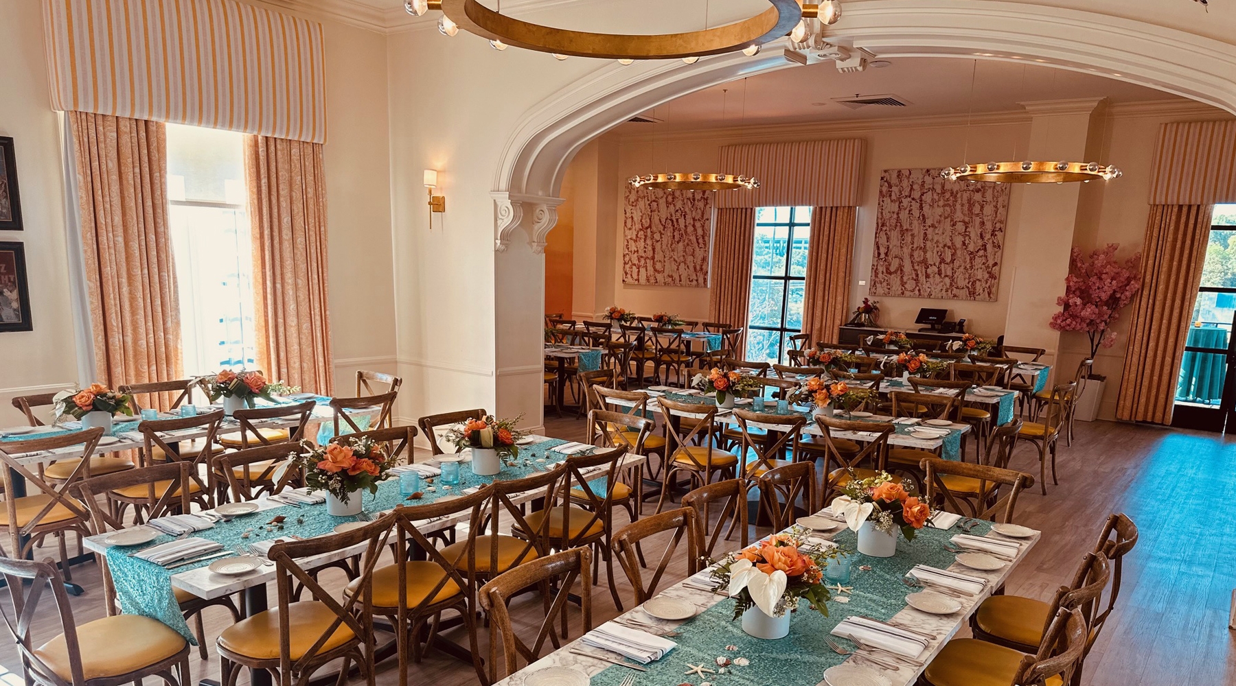 Long tables and seating area in event room
